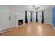 Bright living room with hardwood floors, fireplace, and abundant natural light at 309 Padgett Loop, Walterboro, SC 29488