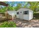 View of outbuilding featuring white siding and an adjacent wood structure at 309 Padgett Loop, Walterboro, SC 29488