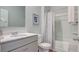 Neutral bathroom featuring shower with tub, gray vanity, and modern fixtures at 316 Salvia St, Moncks Corner, SC 29461
