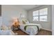 Bright bedroom with a large window offering neighborhood views and warm natural light at 316 Salvia St, Moncks Corner, SC 29461