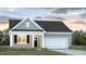 Charming one-story home with gray siding, white trim, and a convenient attached two-car garage at 316 Salvia St, Moncks Corner, SC 29461