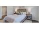 Beautifully decorated main bedroom with soft lighting, elegant decor, and hardwood floors at 316 Salvia St, Moncks Corner, SC 29461