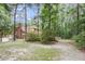 Large backyard surrounded by mature trees at 320 Compton Xing, Summerville, SC 29485
