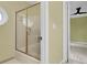 Bathroom with tub-shower and glass doors located near bedroom at 320 Compton Xing, Summerville, SC 29485