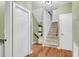 Hallway with hardwood floors, stairs, and a closet at 320 Compton Xing, Summerville, SC 29485