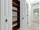 Hallway with built-in shelving and access to other rooms at 320 Compton Xing, Summerville, SC 29485