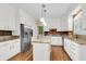 Spacious kitchen features a center island, stainless steel appliances, and ample cabinet storage at 320 Compton Xing, Summerville, SC 29485