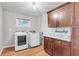Laundry room featuring updated appliances and custom cabinets at 320 Compton Xing, Summerville, SC 29485