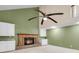 Cozy living room with brick fireplace, built in cabinets, and light green walls at 320 Compton Xing, Summerville, SC 29485