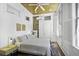 Bedroom with exposed brick, a ceiling fan, and two windows for ample light at 33 Pitt St # 3, Charleston, SC 29401