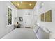 Bright bedroom with wood floors, a ceiling fan, desk, and one large window at 33 Pitt St # 3, Charleston, SC 29401