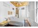 Bedroom with exposed brick, a ceiling fan, and two windows for ample light at 33 Pitt St # 3, Charleston, SC 29401