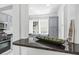 Kitchen featuring stainless appliances, gray cabinets, granite countertops, and natural light at 33 Pitt St # 3, Charleston, SC 29401