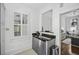 A well-lit kitchenette featuring stainless steel appliances and granite countertops at 33 Pitt St # 3, Charleston, SC 29401