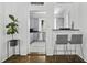 Kitchen area with light-gray cabinets, a black countertop, and stainless steel appliances at 33 Pitt St # 3, Charleston, SC 29401