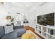 Bright living space with view of the kitchen, hardwood floors, modern decor, and natural light at 33 Pitt St # 3, Charleston, SC 29401