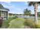 Lawn extends toward a lake, offering views from the screened-in porch and back of property at 3310 Hartwell St, Johns Island, SC 29455