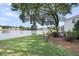 Picturesque backyard with large tree, hammock, and lake views creating a tranquil setting at 3310 Hartwell St, Johns Island, SC 29455