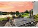 Outdoor patio features wrought iron table, stainless grill, and a relaxing lake view sunset at 3310 Hartwell St, Johns Island, SC 29455