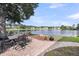 Waterfront patio with wrought iron outdoor dining set offering serene water view at 3310 Hartwell St, Johns Island, SC 29455