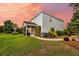Backyard with screened porch, stainless steel grill, patio, and manicured landscaping at 3310 Hartwell St, Johns Island, SC 29455