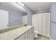 Bathroom features a spacious granite countertop vanity and a shower with curtain rod at 3310 Hartwell St, Johns Island, SC 29455