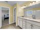Bathroom featuring a double vanity with granite countertops, tile floor and view to bedroom at 3310 Hartwell St, Johns Island, SC 29455