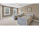 Neutral-toned bedroom with two twin beds and sun-filled windows with bright, natural light at 3310 Hartwell St, Johns Island, SC 29455