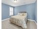 Bedroom with neutral walls, plush carpet, a double window and a comfortable queen bed at 3310 Hartwell St, Johns Island, SC 29455