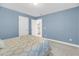 Bedroom with neutral walls, plush carpet and a queen bed with doorway view to bathroom at 3310 Hartwell St, Johns Island, SC 29455