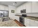 Well-lit kitchen with stainless steel appliances, granite countertops, and abundant cabinet space at 3310 Hartwell St, Johns Island, SC 29455
