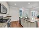 Kitchen with stainless steel appliances, granite counters, and a large kitchen island at 3310 Hartwell St, Johns Island, SC 29455