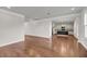 Open-concept living room showcasing hardwood floors and seamless flow into a modern kitchen with granite countertops at 3310 Hartwell St, Johns Island, SC 29455