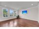 Living room with hardwood floors, recessed lighting, and bright windows at 3310 Hartwell St, Johns Island, SC 29455