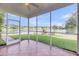 Screened in porch with tile flooring provides an outdoor view of lake and backyard at 3310 Hartwell St, Johns Island, SC 29455
