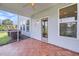 Covered porch features gray siding, tile flooring, a ceiling fan and a view of backyard at 3310 Hartwell St, Johns Island, SC 29455