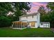 Spacious backyard featuring a screened porch, lush green lawn, storage shed, and raised garden beds at 334 Mossy Oak Way, Mount Pleasant, SC 29464