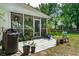 A backyard patio with covered lanai, fenced yard, and mature trees at 334 Mossy Oak Way, Mount Pleasant, SC 29464