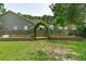 Backyard featuring a large garden with two planting beds and an archway at 334 Mossy Oak Way, Mount Pleasant, SC 29464