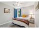Cozy bedroom with a bright window, yellow accent pillows, and blanket at 334 Mossy Oak Way, Mount Pleasant, SC 29464