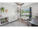 Bright Bedroom with white crib and lots of storage for books and toys at 334 Mossy Oak Way, Mount Pleasant, SC 29464