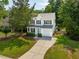 Charming two-story home featuring a well-maintained yard, driveway, and attached garage at 334 Mossy Oak Way, Mount Pleasant, SC 29464