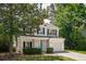 Beautiful two-story home with a blue door, manicured lawn, and attached garage at 334 Mossy Oak Way, Mount Pleasant, SC 29464