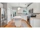 Charming kitchen with white cabinets, stainless appliances, an island, and hardwood floors at 334 Mossy Oak Way, Mount Pleasant, SC 29464