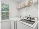 Laundry room featuring new washer and dryer, and storage shelf at 334 Mossy Oak Way, Mount Pleasant, SC 29464