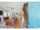 Inviting living room features hardwood floors, a ceiling fan, and a view of the dining area and staircase at 334 Mossy Oak Way, Mount Pleasant, SC 29464