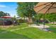 Relaxing backyard with a gazebo, barbecue grill, and stone firepit area and large, grassy lawn at 3364 Middlesboro Ave, Summerville, SC 29485