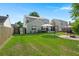 Spacious backyard boasts lush green grass, mature trees, and a charming fire pit area at 3364 Middlesboro Ave, Summerville, SC 29485