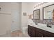 Bathroom featuring double sinks, decorative mirrors, and tiled accents at 3364 Middlesboro Ave, Summerville, SC 29485