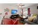 Cozy living room featuring a large TV, sectional sofa, hardwood floors, and ample natural light at 3364 Middlesboro Ave, Summerville, SC 29485